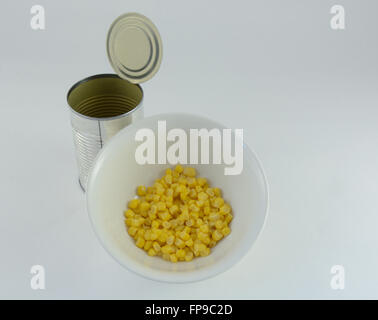 Canned corn in bowl with empty can Stock Photo