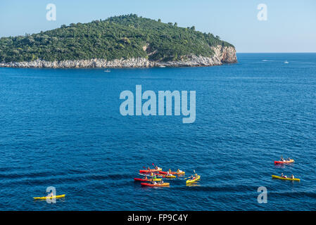 Canoeing trip on Adriatic Sea near Old Town of Dubrovnik city, Croatia. Lokrum Island on background Stock Photo