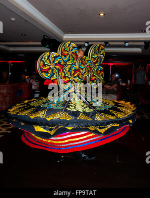 An Egyptian Sufi, Whirling dervish, performing on board a Nile Cruise ship Stock Photo