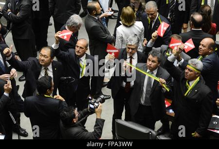 Members of the Congress of Deputies demand the impeachment of Brazilian President Dilma Rousseff on corruption charges March 17, 2016 in Brasilia, Brazil. Former President Lula da Silva was sworn-in as chief of staff in an attempt to avoid prosecution in a massive corruption scandal. Stock Photo