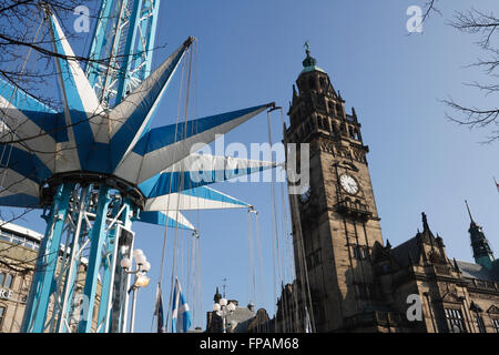 fair ground carousel and Sheffield town hall clock tower Stock Photo