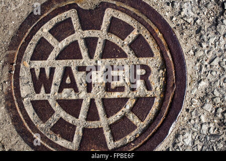 Closeup of Water manhole cover with copy space Stock Photo