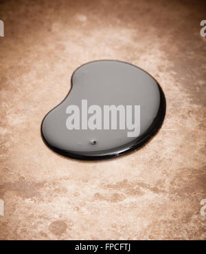 Crude oil spill on metal background Stock Photo