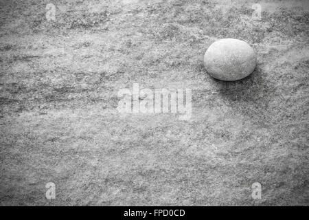 Black and white stone on rock, grunge background or texture. Stock Photo