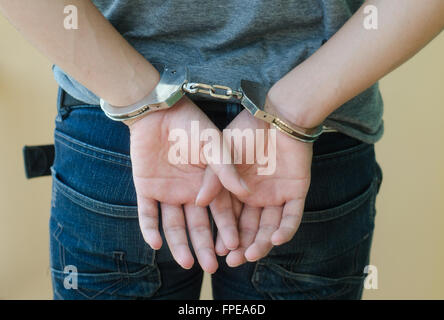 Man in handcuffs behind his back