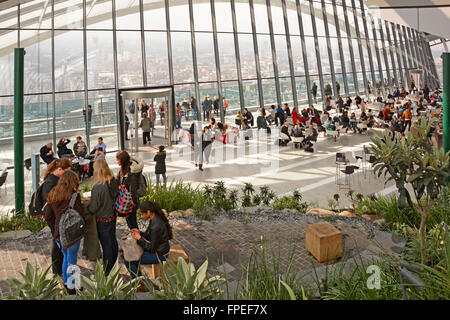 Visitors & tourists at public Sky Garden at top of landmark Walkie Talkie skyscraper office building at 20 Fenchurch Street City of London England UK Stock Photo