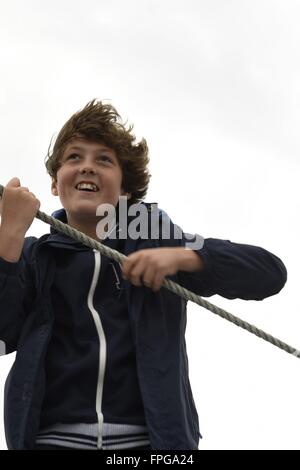 Boy on Sailing Boat Stock Photo