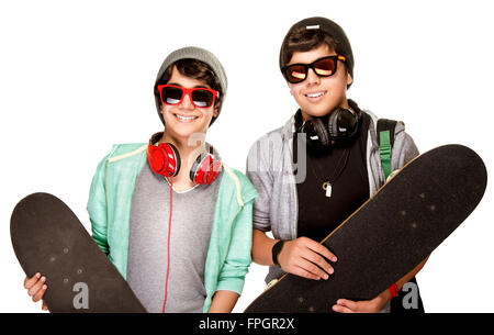 Portrait of two happy teen boys with skateboards isolated on white background, cool trendy look, active urban lifestyle of youth Stock Photo