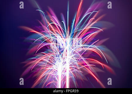Beautiful colorful firework over dark night sky, celebrating of great holiday, festive evening Stock Photo