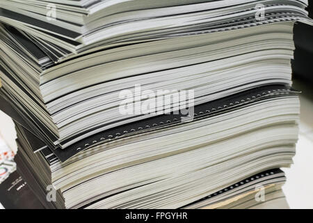 stack of black perforated printed sheets Stock Photo