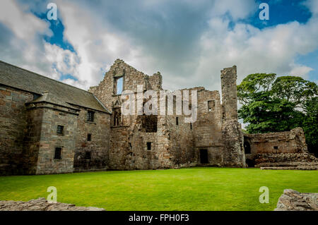 Ruins of Aberdour Castle in Fife, Scotland with Blue and Stormy Skies. Stock Photo