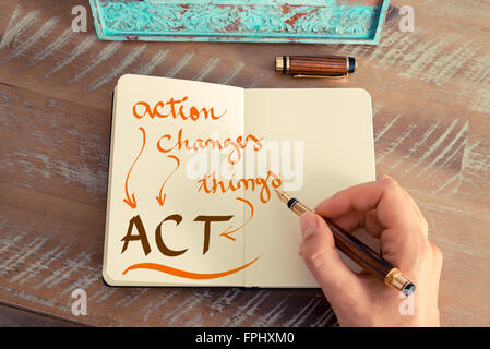 Handwritten text ACT ACTION CHANGES THINGS, business success concept Stock Photo