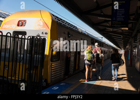 Train passengers boarding an Inter-City local double-decker train service at Central Rail Station in Sydney, New South Wales, Au Stock Photo