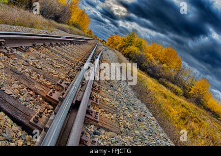 Train tracks heading to the storm. Stock Photo