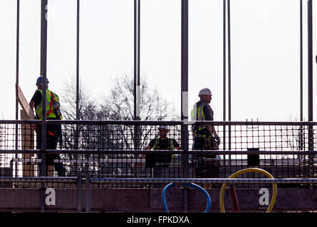 construction workers on the roof at a housing building site Stock Photo