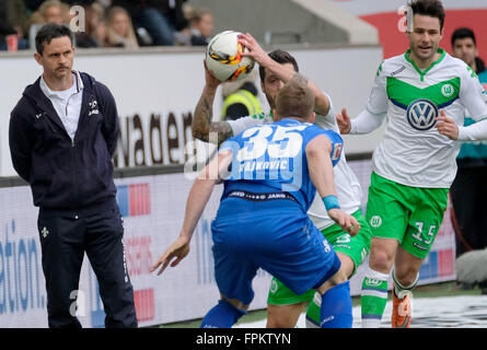 Wolfsburg, Germany. 19th Mar, 2016. Darmstadt's coach Dirk Schuster (l) during the German Bundesliga soccer match between VfL Wolfsburg and SV Darmstadt 98 at the Volkswagen arena in Wolfsburg, Germany, 19 March 2016. PHOTO: PETER STEFFEN/dpa (EMBARGO CONDITIONS - ATTENTION: Due to the accreditation guidlines, the DFL only permits the publication and utilisation of up to 15 pictures per match on the internet and in online media during the match.) © dpa/Alamy Live News Stock Photo
