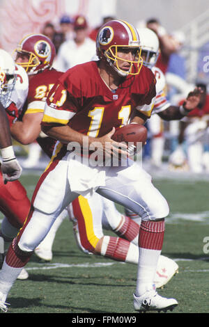 San Francisco, California, USA. 12th Jan, 1991. San Francisco 49ers vs  Washington Redskins at Candlestick Park Saturday, January 12, 1991. 49ers  beat Redskins 28-10. Redskin quarterback Mark Rypien (11) hands off to