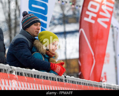 MOSCOW - JANUARY 17, 2016: Unidentified man and girl on tribune during Russian Curling Champions Tour Moscow Classic 2016 on January 17, in Moscow, Russia, 2016 Stock Photo