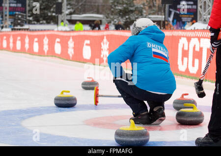 MOSCOW - JANUARY 17, 2016: Curling player V. Telezhkin in action during Russian Curling Champions Tour Moscow Classic 2016 on January 17, in Moscow, Russia, 2016 Stock Photo