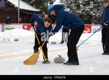 MOSCOW - JANUARY 17, 2016: Curling players A. Kirikov (L) and S. Morozov (R) in action during Russian Curling Champions Tour Moscow Classic 2016 on January 17, in Moscow, Russia, 2016 Stock Photo