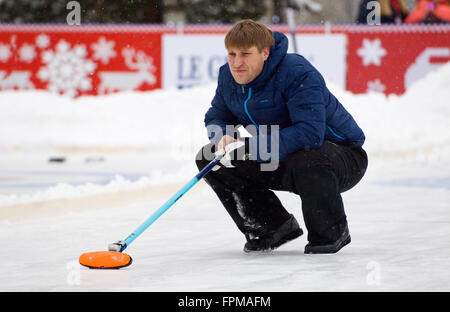 MOSCOW - JANUARY 17, 2016: Curling player D. Abanin in action during Russian Curling Champions Tour Moscow Classic 2016 on January 17, in Moscow, Russia, 2016 Stock Photo