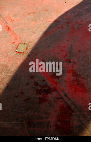 Scratched plastic red table top at cafe, Pangkor Island, Malaysia. Stock Photo