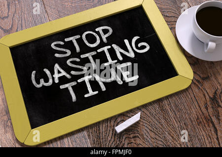 Stop Wasting Time Concept Hand Drawn on Chalkboard. Stock Photo