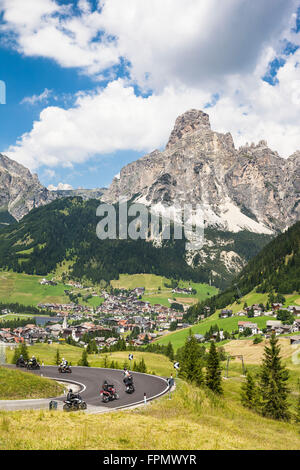 Motorcyclist, Corvara,in the background the Sassongher, the Dolomites, South Tyrol, Italy, Europe, Stock Photo