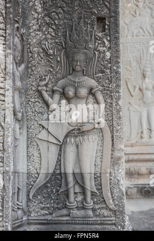 Angkhor Wat, Cambodia - January 29 2016: Bas Relief from the famous Temple, built by Suryavarman II 1112 - 1152 showing attracti Stock Photo