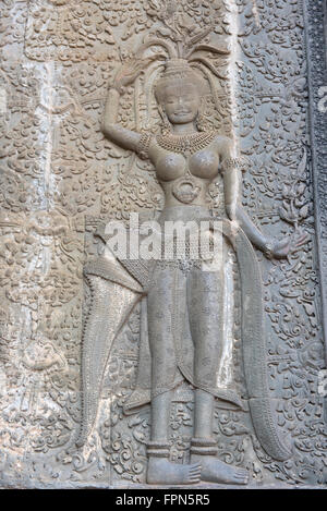 Angkhor Wat, Cambodia - January 29 2016: Bas Relief from the famous Temple, built by Suryavarman II dancing woman or deity Stock Photo