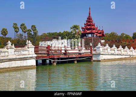 Gate and bridge over the moat of the Mandalay Palace, Mandalay, Myanmar (Burma) Stock Photo