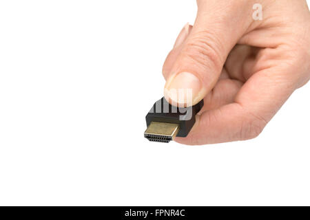 Hand is holding  HDMI cable isolated on a white background Stock Photo