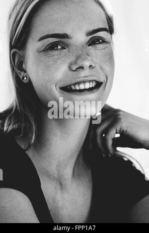 Young woman smiling at the camera, Stock Photo