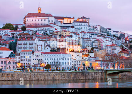 The skyline of the old centre of the medieval city of Coimbra, with the university and upper city on top of the hill and the Mondego River, Portugal Stock Photo