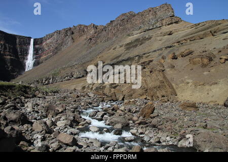 Hengifoss - a waterfall near Egilsstadir in eastern Iceland showing striped sediment layers in basalt cliff Stock Photo