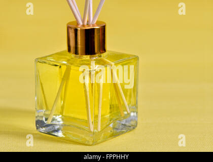Reed diffuser room scenter on a yellow background Stock Photo