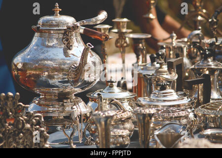 Silver and Porcelain Tea Set in a street market Stock Photo