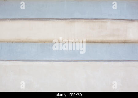Two-toned blue and white stucco painted wall Stock Photo