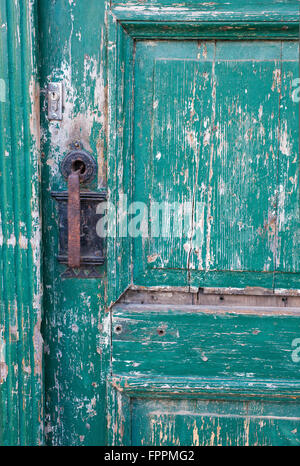 Weathered green painted door Stock Photo