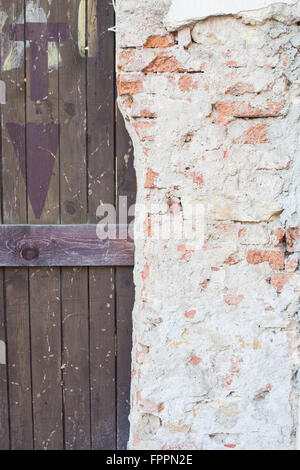 Old weather door and brick wall Stock Photo