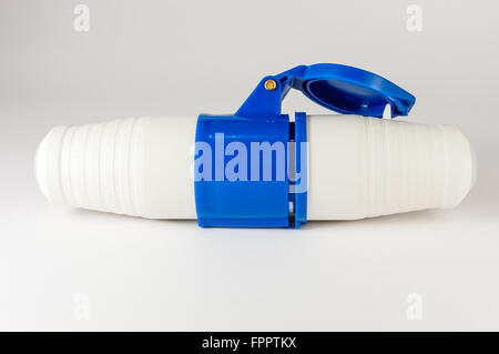Electric plastic power plug and socket with cap isolated on white background Stock Photo