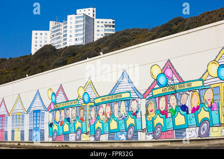 Painting of the beach huts on the side of building, the shed for housing the landtrain, between Bournemouth and Boscombe piers with Albany flats Stock Photo