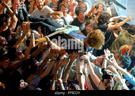 BARCELONA - MAY 30: The guitar player of Ty Segall (band) performs above the spectators. Stock Photo