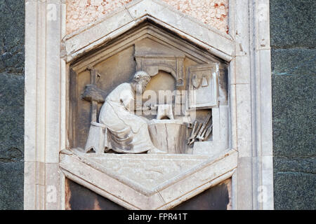 Tubalcain by Nino Pisano, 1334-36., Relief on Giotto Campanile of Cattedrale di Santa Maria del Fiore, Florence, Italy Stock Photo