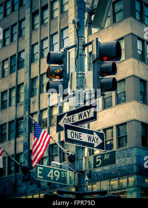 5th Avenue sign, One Way sign, E49st sign, Traffic lights, New York, USA. Stock Photo