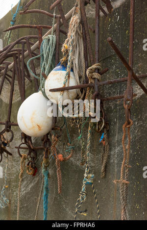 Various items on quay side for boats Stock Photo
