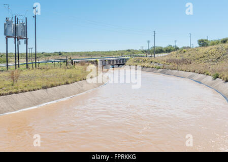 SOMERSET EAST, SOUTH AFRICA - FEBRUARY 19, 2016: Water originating from the Ovis Tunnel in a canal shortly after leaving the Coo Stock Photo