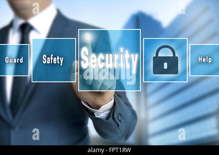 Security touchscreen is operated by businessman. Stock Photo