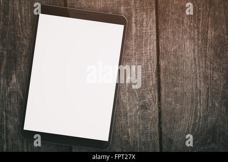 generic tablet pc with blank screen on wood table Stock Photo