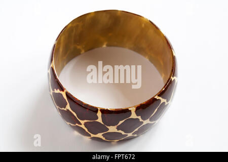 Brown giraffe design bangle isolated on white background Stock Photo
